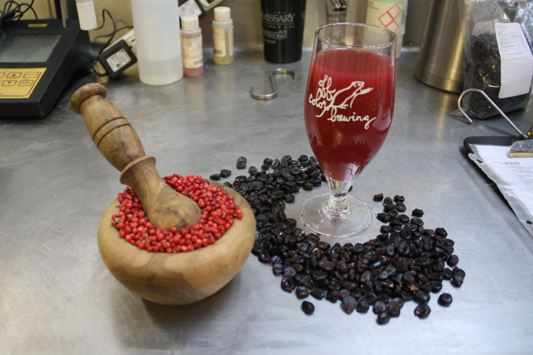 The Field Museum partnered with Off Color Brewing to produce Wari, a beer named for its ancient creators. Wari, shown here surrounded by purple corn and pink peppercorns has a 4.0% ABV and IBU of about 3.