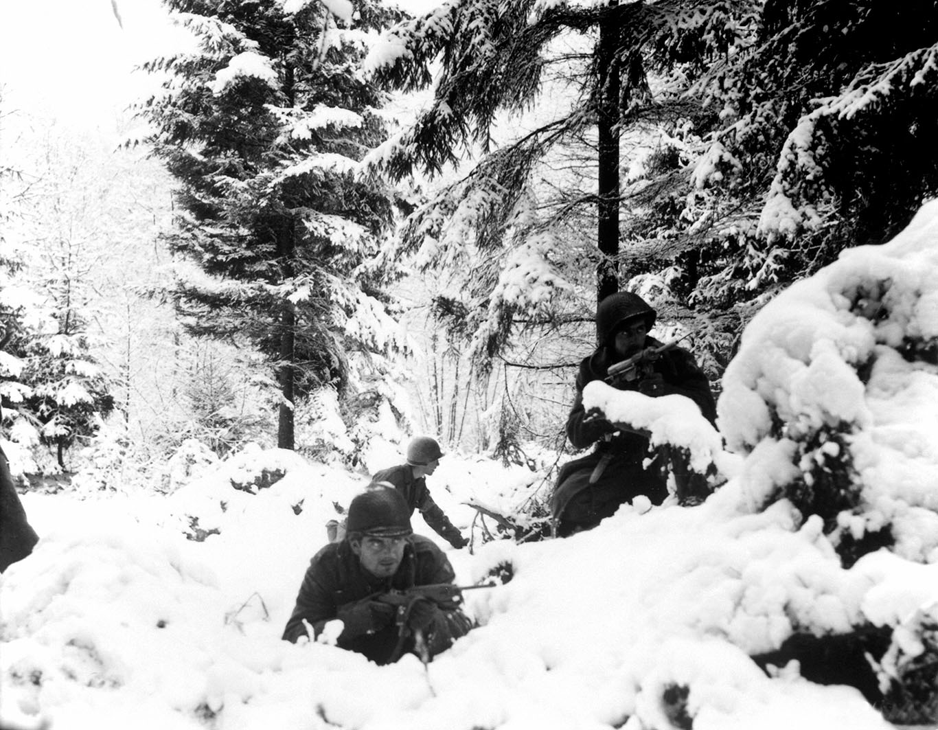 soldiers hiding in snowy bushes