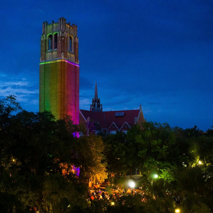 Century Tower at night, lit with rainbow colors