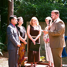 Antonio-Sajid Lopez (right) marries Carlos Roberto Ayerdi (left), in a ceremony officiated by UF SPS alumn Christina Stokes (center), and witnessed by SPS faculty member Kathy Navajas and Aleisa Zoecklein.