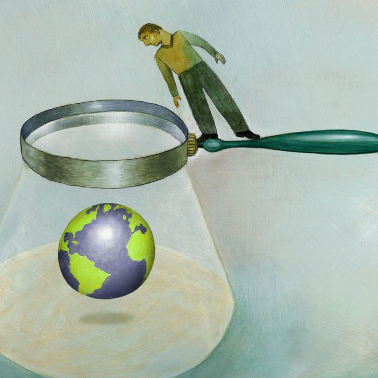 illustration of person looking through giant magnifying glass at a globe