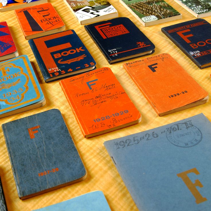 colorful small books spread out over table