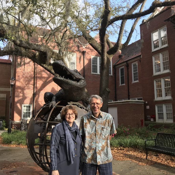 Mireille Tremblay and Raymond Mougeon standing in front of Gator sculpture