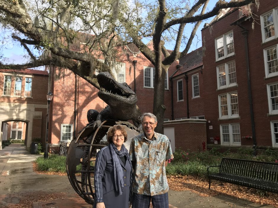 Mireille Tremblay and Raymond Mougeon standing in front of Gator sculpture