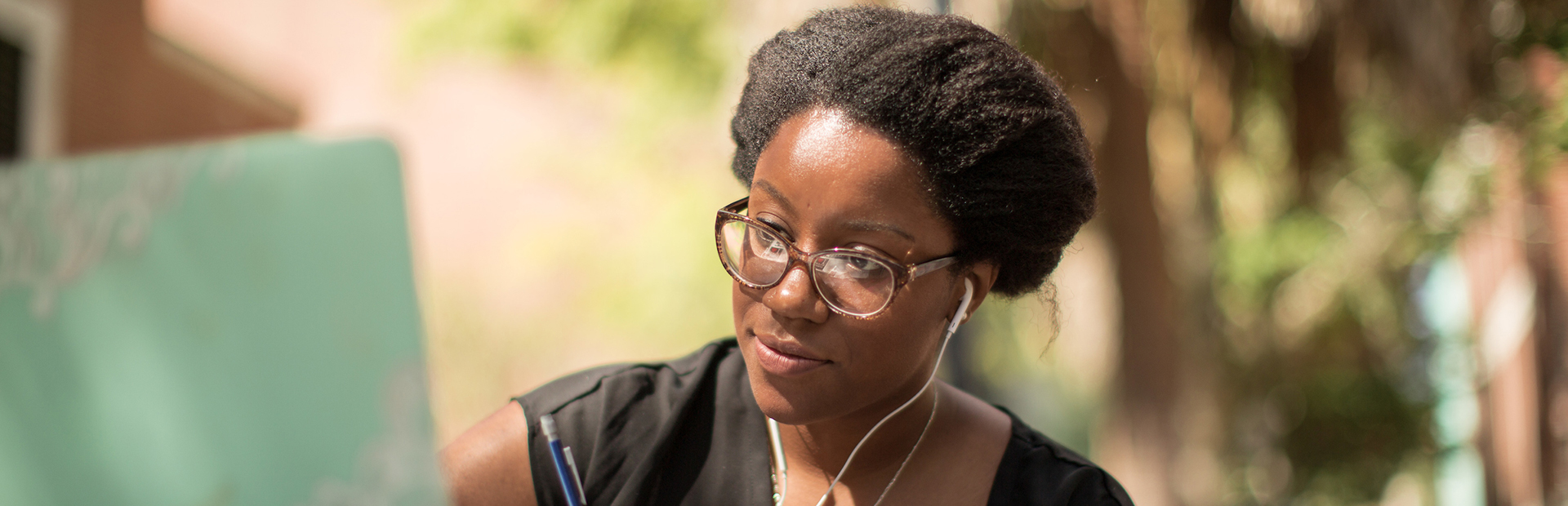 Student writing while studying