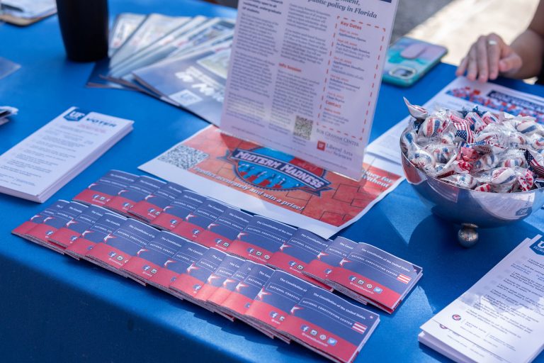 A tabling event with midterm election materials.
