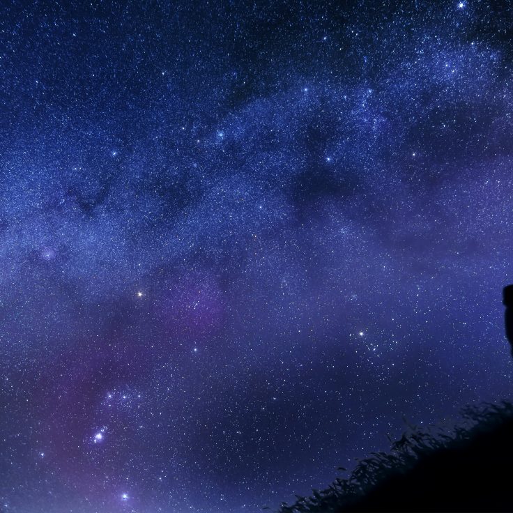 A man looking up at the stars