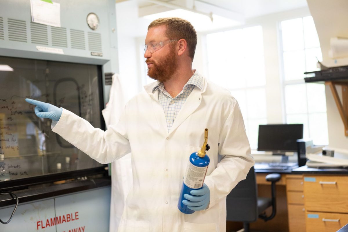 Austin Evans pointing while holding a blowtorch