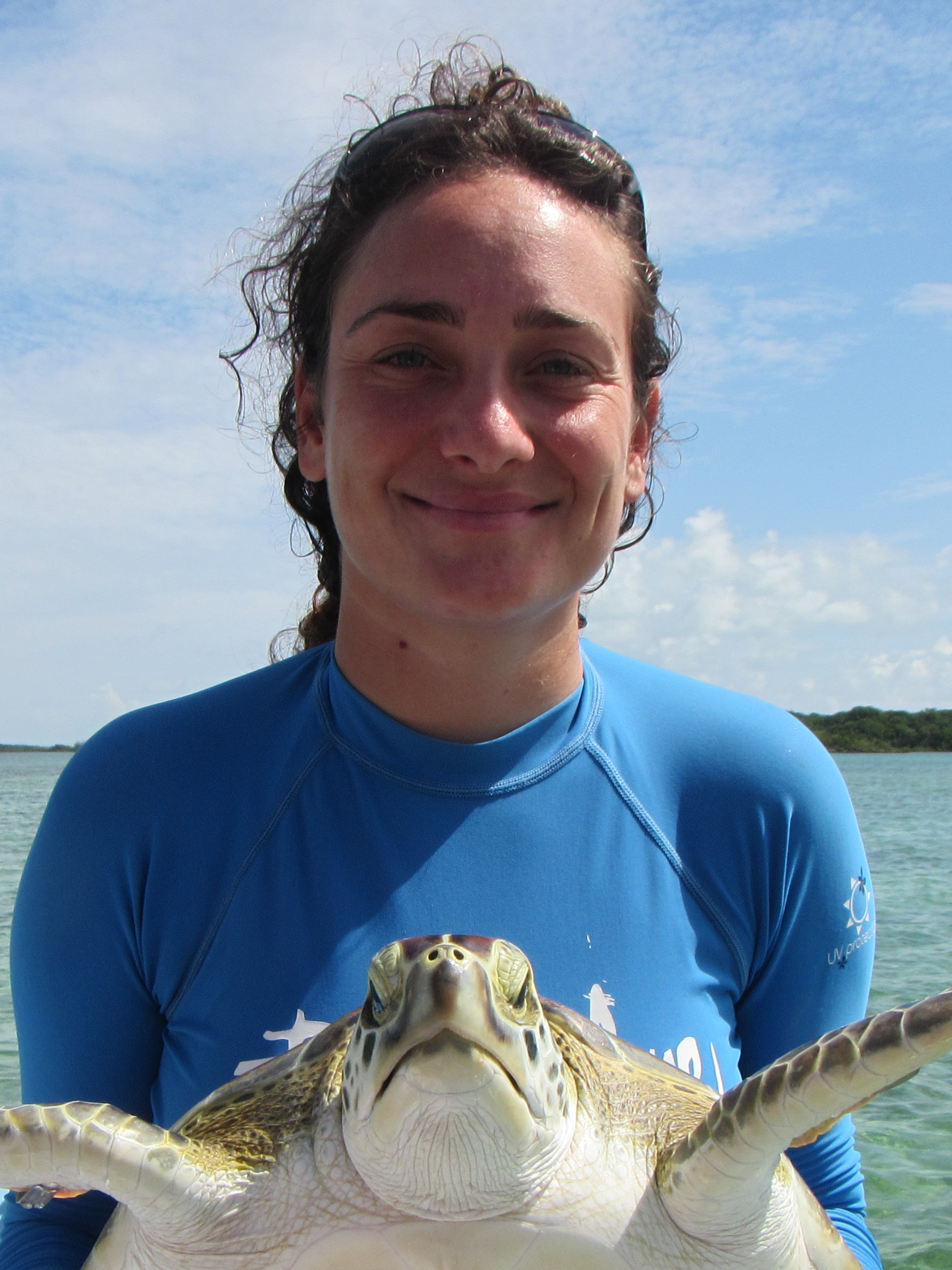 Nerine Constant holding a green sea turtle