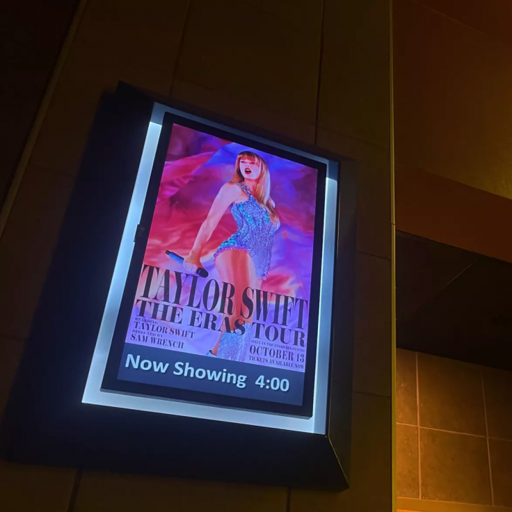 An Eras Tour poster hanging in a Gainesville movie theater