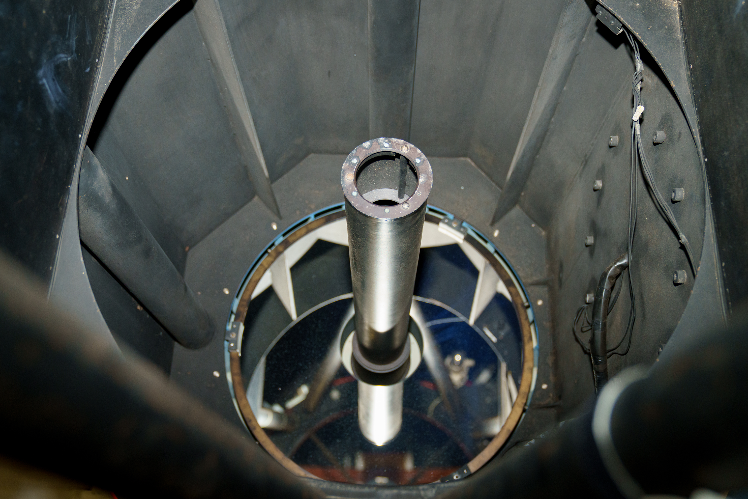The interior of the 30-inch telescope, with a large mirror and several electrical components.