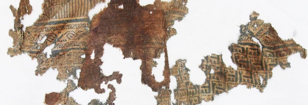 A tattered and faded fragment of Chimú textile